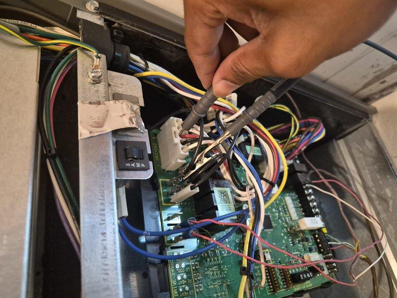 Responded to no cooling complaint at residential property. Upon arrival, performed diagnostic evaluation of air conditioning system. Inspected control board assembly and electrical connections, checking for proper voltage and amperage readings using clamp meter. Measured system performance and verified all wiring connections to circuit board were secure. Documented equipment information and current operating conditions for service records.