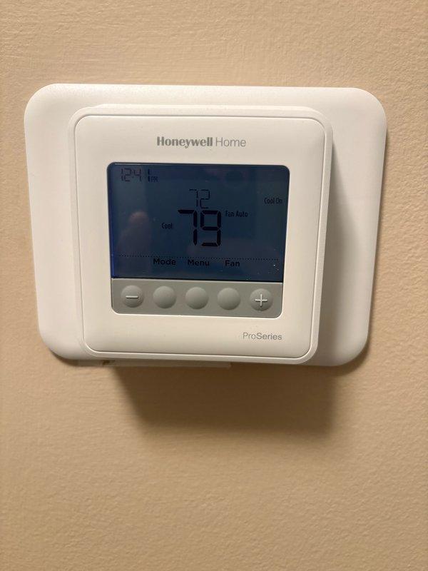 Responded to no cooling complaint on rooftop HVAC unit. Upon arrival, thermostat displayed 79 degrees with system powered off by occupant after previously reading 78 degrees. Performed comprehensive diagnostic evaluation of rooftop package unit including visual inspection of condenser, electrical connections, and control wiring. Verified thermostat programming and settings on Honeywell ProSeries controller. Checked refrigerant pressures, airflow operation, and cycling functionality. Inspected air filter condition and confirmed electrical breakers were properly set. System tested through complete cooling cycle with all components operating within manufacturer specifications. Unit cooling properly at time of inspection with no mechanical failures identified.