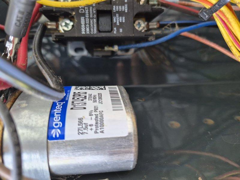 Responded to no cooling complaint on residential air conditioning system. Upon inspection, found failed dual-run capacitor with visible corrosion on mounting bracket and terminals. Capacitor tested below acceptable microfarad range, preventing compressor and condenser fan motor from operating properly. Replaced defective Genteq capacitor with new OEM-equivalent component, verified proper electrical connections, and tested system operation. Unit now cooling normally with compressor and outdoor fan motor running within manufacturer specifications.