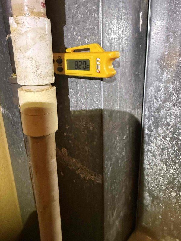 Responded to no cooling complaint on commercial HVAC system. Upon arrival, found system low on refrigerant with suction line temperature reading 82.2°F, indicating insufficient charge. Previous service history from 2022 showed R22 refrigerant and Easy Seal leak sealant were added to system, suggesting recurring refrigerant leak issue. Inspected outdoor condensing unit and electrical components, including dual run capacitors which tested within normal operating range. System requires further leak detection and possible refrigerant recharge, though recurring leak pattern may indicate need for system replacement evaluation per commercial protocol.