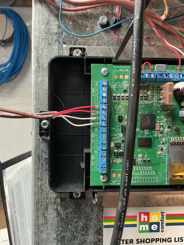 Installed new thermostat wire to basement zone and connected to zone control panel. The multi-zone HVAC system now has proper communication between the smart thermostat display and the basement Zone 2, allowing independent temperature control of the first floor (Zone 1) and basement (Zone 2) areas.