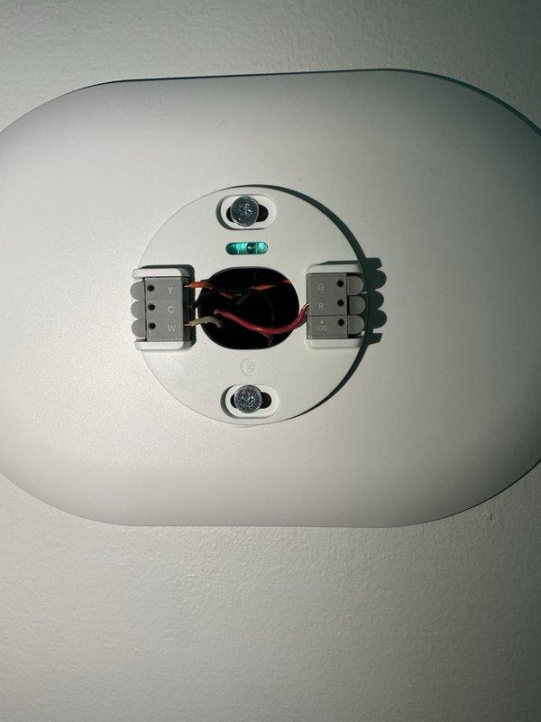 Responded to no cooling complaint on residential air conditioning system. Upon arrival, confirmed indoor fan motor was not operating when thermostat called for cooling. Inspected outdoor condenser unit and verified compressor was not running. Checked electrical disconnect and confirmed power supply to unit. Removed thermostat cover to inspect wiring connections and found loose wire terminal at thermostat base. Secured all thermostat connections and verified proper voltage at equipment. Tested system operation and confirmed both indoor blower and outdoor condenser now cycling properly with adequate airflow and cooling output restored.