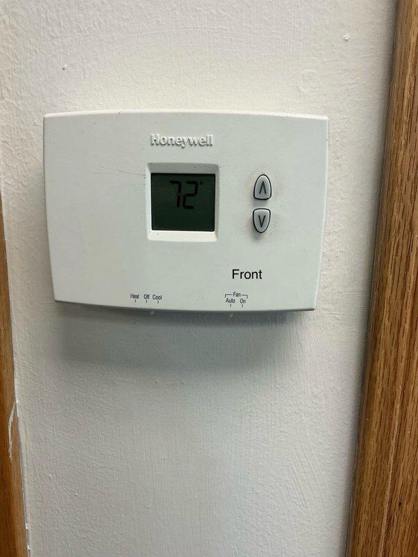Responded to no cooling complaint at commercial facility. Inspected two Honeywell thermostats serving front office and rear warehouse areas. Both units displayed proper temperature readings and appeared to be in operational condition at time of service. Customer service appointment completed with system status documented via photos.