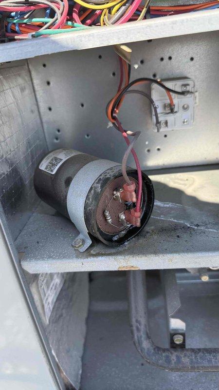 # HVAC Service - No Cool - Comm

Responded to no cooling complaint in commercial meeting room. Upon inspection, discovered failed run capacitor with severe corrosion and deterioration on terminal connections. Removed defective capacitor, installed new replacement unit, verified proper wire connections, and tested system operation. Unit restored to full cooling capacity and left operational.
