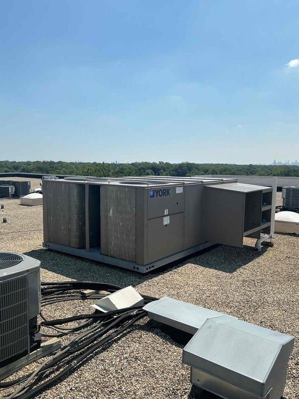 Completed Summer 2026 Clean and Check maintenance on commercial rooftop YORK packaged HVAC unit and ASPEN model AFW30G-00H+J74SL air handler system. Performed comprehensive inspection of rooftop unit including cleaning condenser coils, checking refrigerant levels, testing electrical connections, and verifying proper operation of all safety controls. Inspected air handler unit, replaced 16x24x2 filter on RTU and 16x16x1 filter on air handler, verified blower motor operation, checked pump relay function, and confirmed all electrical specifications within manufacturer parameters. All equipment operating properly with no issues found; system ready for cooling season operation.