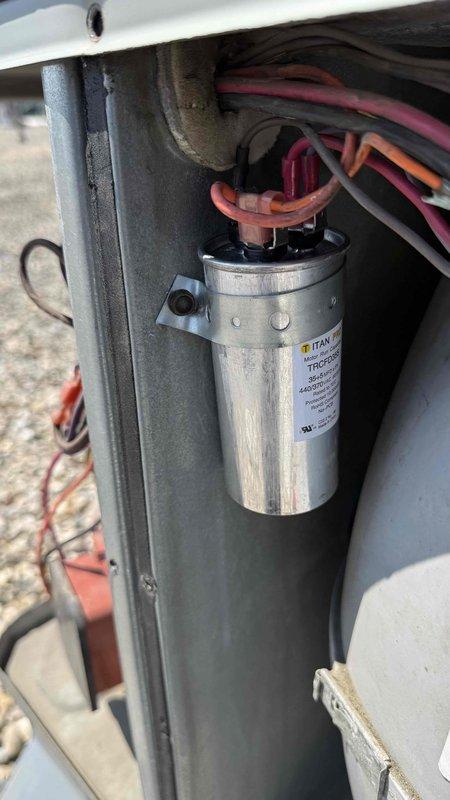 Responded to commercial rooftop HVAC unit requiring capacitor replacement. Replaced defective hard start capacitor and dual-run 35/5 capacitor on packaged rooftop unit. Accessed internal compressor compartment, removed failed capacitors, installed new components with proper electrical connections, and verified all wire terminations were secure. Unit tested and returned to normal operation.