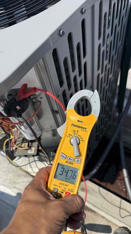 Completed annual Comfort Plan clean and check maintenance on single HVAC system. Performed comprehensive inspection including refrigerant pressure diagnostics measuring 446 PSI on high side, electrical testing with clamp meter showing 34.76 amp draw on compressor, and visual inspection of copper line sets and condenser unit components. All system parameters found within normal operating range, unit operating efficiently with no deficiencies noted.