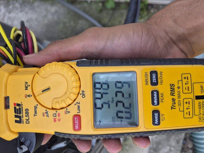 Completed preventative maintenance clean and check on single HVAC system per comfort plan agreement. Inspected outdoor condenser unit, noting moderate dirt and debris accumulation on coil fins with visible streaking patterns. Performed electrical diagnostics using digital multimeter, recording microamp DC readings to verify system performance and component integrity. Unit operational upon completion of service visit.