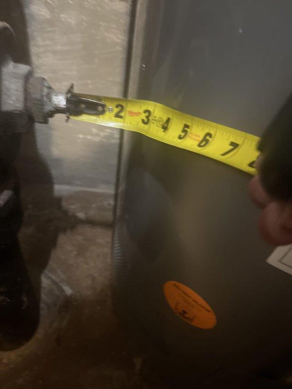 Conducted water heater replacement estimate for a 10-year-old Rheem unit with previous rust issues. Assessed existing power vent configuration with PVC venting system and documented current installation measurements and specifications. Customer requested proactive replacement evaluation due to prior deterioration concerns.