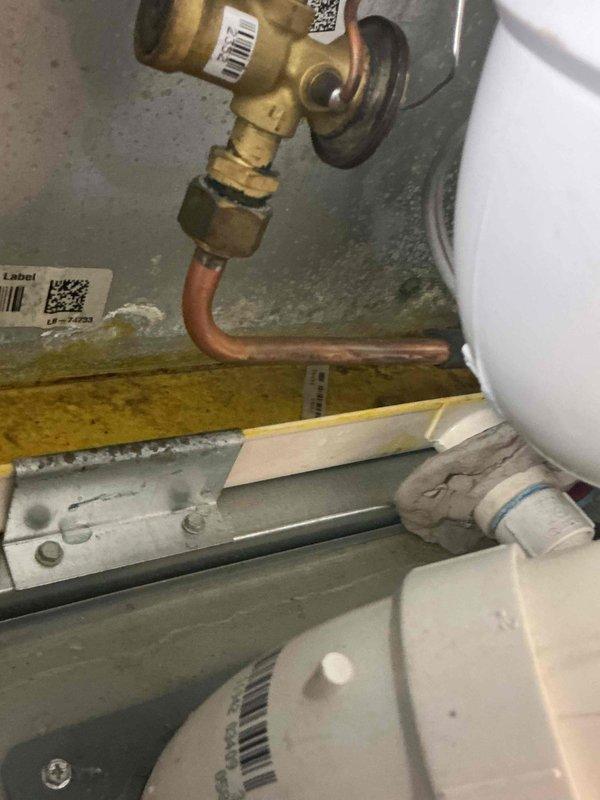Responded to callback for cooling system with water leakage issue on 6-9 year old equipment. Addressed clogged condensate drain line causing overflow in drain pan and saturated air filter. Cleared blockage in condensate drainage system, verified proper flow, and inspected associated plumbing connections and drain pan assembly to ensure system was draining correctly.
