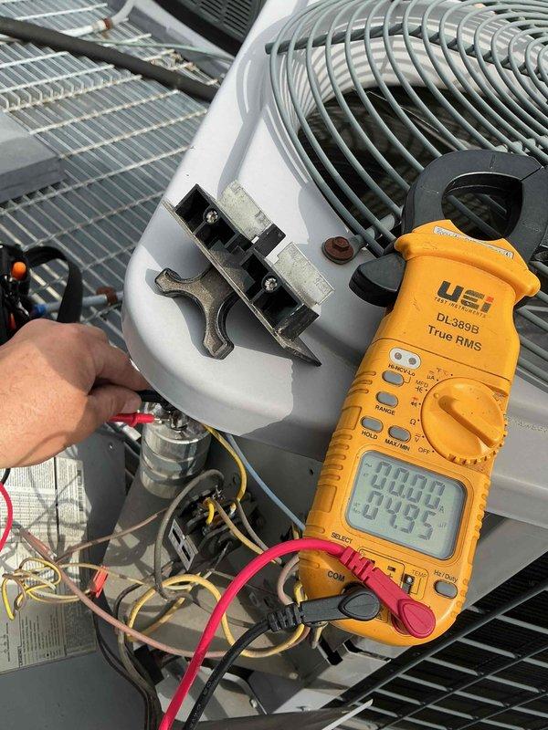 Completed spring clean and check maintenance on rooftop air conditioning unit per comfort plan agreement. Coordinated with front desk and building engineers for rooftop access, performed comprehensive system inspection including electrical testing with digital multimeter to verify proper voltage and amperage readings, inspected and tested capacitor connections, examined blower motor assembly and electrical connections, and checked condensate drainage system. All components found operating within normal parameters.