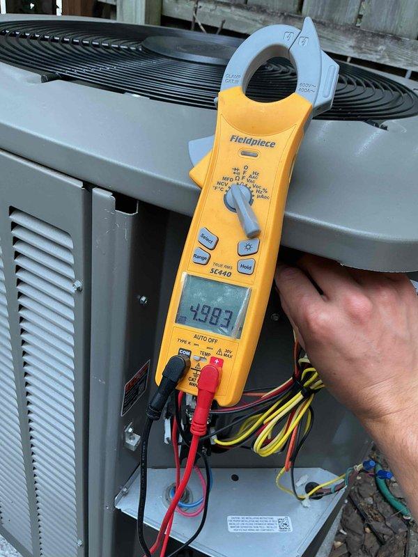 Completed preventive maintenance clean and check on air conditioning system per comfort plan agreement. Performed comprehensive system inspection including temperature differential measurements across evaporator coil (13.3°F recorded), electrical diagnostics with amp draw readings (199.3 reading documented), and verification of proper unit operation. All components found operating within manufacturer specifications with no deficiencies noted at time of service.
