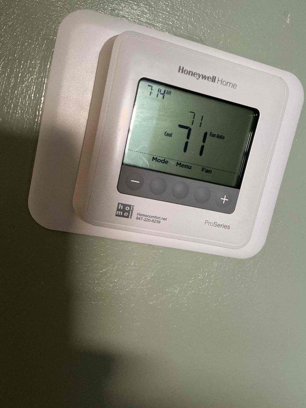 Responded to service call for air conditioning system with fan running continuously. Upon inspection, found Honeywell Home ProSeries programmable thermostat set to cooling mode with fan operation issue. Diagnosed thermostat fan setting configuration causing constant fan operation. Adjusted thermostat settings from continuous fan operation to automatic mode, resolving the issue. Verified outdoor condenser unit operation and confirmed system cycling properly with fan now operating only during cooling cycles as designed.