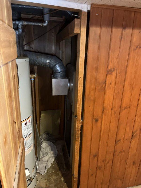 Conducted comprehensive assessment of existing HVAC system for full replacement estimate. Documented severely outdated equipment including furnace dating from the 1960s and air conditioning unit over 20 years old, both located in utility closet with water heater. Evaluated existing ductwork configuration, mechanical space constraints, and current system layout to develop replacement specifications and installation requirements.