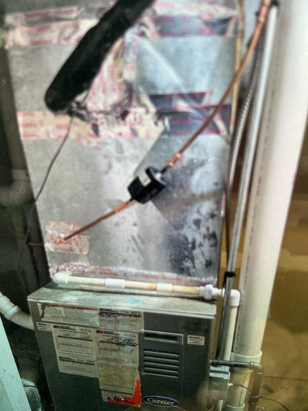 Completed warranty replacement of second floor evaporator coil on Carrier HVAC system. Removed defective coil, installed new unit, evacuated and charged refrigerant lines to manufacturer specifications using manifold gauges, and verified proper system operation. Defective coil retained for warranty processing per protocol rather than scrapped on site.
