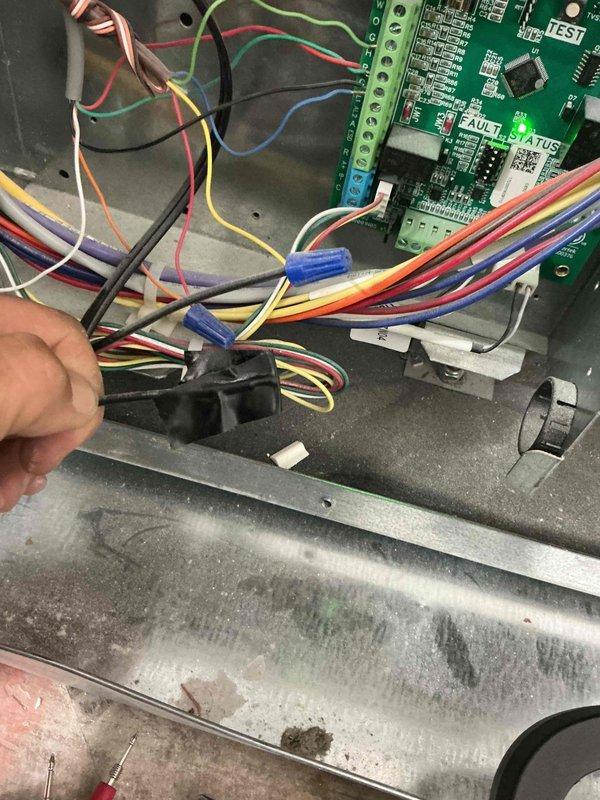 Responded to no cooling call on recently installed system under warranty. Upon arrival, inspected control board and wiring connections within furnace cabinet. Found loose wire connection at control board terminal block that had worked free since installation. Secured all wire connections to circuit board terminals, verified proper seating of all connectors, and tested system operation. Unit powered on successfully with all control sequences functioning normally. Confirmed proper voltage at board, tested safety circuits, and verified communication between thermostat and control board. System now cooling properly with no faults detected.