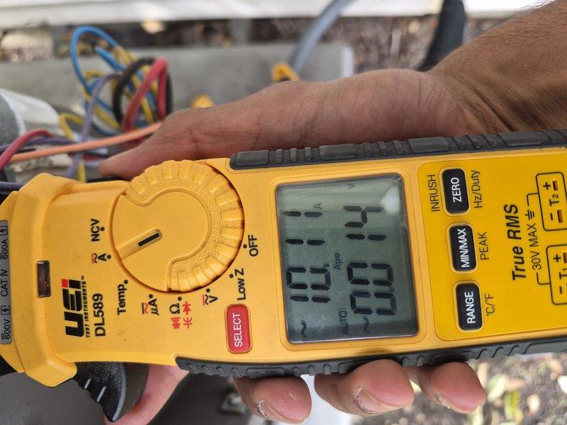 Responded to no cooling complaint on residential air conditioning system. Upon arrival, verified thermostat settings and confirmed unit was not producing cold air. Performed diagnostic evaluation of outdoor condensing unit with access panel removed. Tested capacitor using digital multimeter to measure microfarad values and voltage readings. Measurements indicated failed dual run capacitor preventing compressor and condenser fan motor from operating properly. Removed defective capacitor from mounting bracket and installed replacement capacitor with correct specifications. Verified all electrical connections were secure and properly terminated. Cycled system through complete operational test to confirm compressor startup, proper amperage draw, and adequate airflow from condenser fan motor. Unit returned to normal cooling operation with no further issues observed.