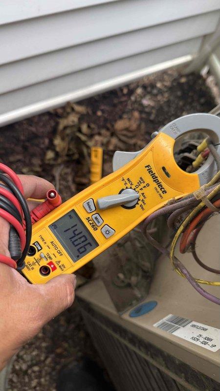 Responded to customer concern regarding water leaking from ductwork in mechanical space. Upon inspection, identified significant condensation accumulation on insulated ductwork surface due to inadequate insulation and temperature differential. Verified WhisperHeat HVAC system operational status and confirmed unit cooling effectively with amperage reading of 14.46 amps at outdoor condensing unit. Inspected ductwork routing through attic/utility space and noted moisture present on flexible duct surfaces. Explained to customer that condensation is forming on cold supply ducts when warm, humid air contacts inadequately insulated duct surfaces. Recommended improving duct insulation and verifying proper vapor barrier installation to prevent future moisture accumulation and potential water damage to surrounding building materials.