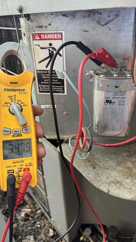 Responded to no cooling complaint with reported frozen coil and water leakage. Upon arrival, system was off with no visible water present. Performed system startup and diagnostics including refrigerant charge verification and temperature differential readings—all parameters within normal range. Identified air filter had not been replaced since March as primary cause of frozen coil condition. Installed new air filter and monitored system operation to confirm resolution.

Performed complete system maintenance inspection per comfort plan enrollment. Testing revealed blower capacitor reading out of manufacturer specifications, condenser capacitor testing outside acceptable range, and contactor showing pitting on contact points. Used digital multimeter to verify capacitor microfarad readings on both blower and condenser components. Discussed repair options and system age considerations with homeowner.

Replaced defective blower capacitor, condenser capacitor, and pitted contactor with new c