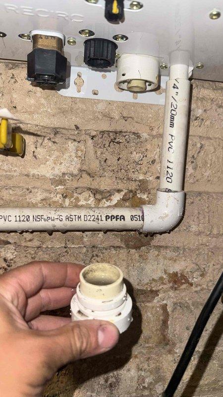 Performed tankless water heater flush service. Isolated unit using service valves, connected submersible pump with braided flex hoses to circulation bucket, and circulated descaling solution through heat exchanger to remove mineral buildup and restore optimal performance.
