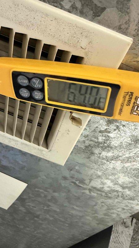 Responded to no cooling complaint on 10+ year old air conditioning system. Performed diagnostic evaluation including thermostat verification, filter inspection, and electrical breaker check. Measured supply air temperature at return grille registering 65°F, confirming inadequate cooling performance. Inspected outdoor condensing unit and accessed electrical compartment to examine capacitor and control components, finding visible signs of age, dust accumulation, and potential component degradation. Coordinated with office regarding property management approval process for condo association billing procedures before proceeding with repairs.
