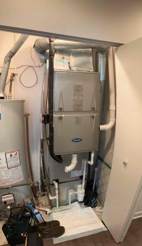 Responded to callback for active water leak initially reported by plumbing contractor. Previous technician was unable to duplicate the issue during initial visit. Upon arrival, performed thorough inspection of Carrier furnace system, evaporator coil, condensate drainage components, and surrounding ductwork in utility closet. Examined all condensate lines, drain pan, and PVC drainage piping for signs of active leakage or blockage. Inspected ductwork insulation for condensation issues, particularly given current humidity levels at 48% as displayed on ecobee thermostat. Documented system conditions and equipment with photographs for reference. Advised homeowner that leak source remains intermittent and most likely occurs during periods of elevated humidity when air conditioning system operates under load, causing either condensate overflow from evaporator coil or condensation formation on uninsulated ductwork sections. Recommended continued monitoring during high humidity conditions to id