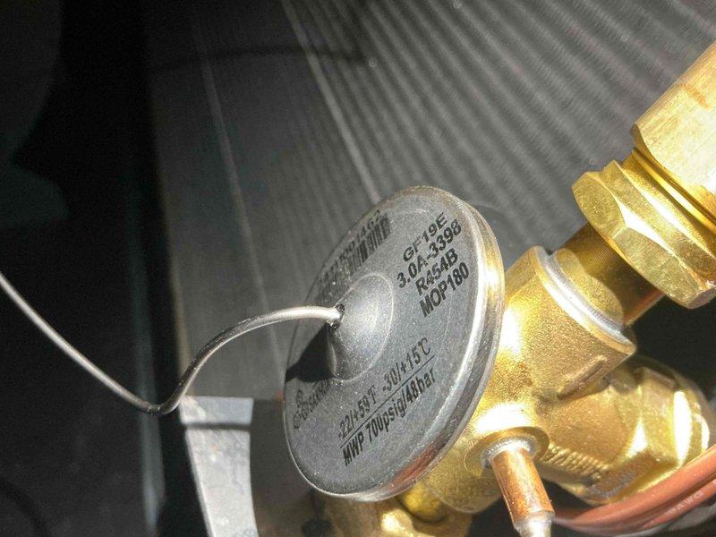 Responded to no cooling complaint and performed diagnostic inspection of outdoor air conditioning unit. Found condenser coil heavily obstructed with dirt, dust, and organic debris accumulation, significantly restricting airflow and reducing system efficiency. Documented equipment information and discussed maintenance recommendations with customer to restore proper system operation.