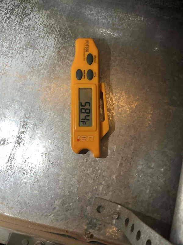 # HVAC Maintenance - Comfort Plan Clean and Check 1 System

Performed comprehensive preventive maintenance on rooftop-mounted air conditioning system per comfort plan agreement. Accessed unit by removing service panels to inspect internal components including compressor, capacitors, refrigerant lines, and electrical connections. Utilized manifold gauges to verify refrigerant pressures and system performance. Measured and recorded temperature readings, documenting 58.4°F at specified test point using digital thermometer to confirm proper cooling operation. All components inspected and found operating within normal parameters. System left in proper working condition with panels secured.