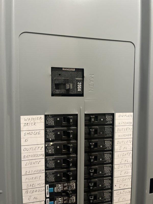 Conducted site assessment for new mini-split installation at residential property. Evaluated existing electrical panel with 1200A main service and available circuit capacity, photographed outdoor HVAC equipment location beneath raised deck with adequate clearance and gravel base, and documented installation requirements for Quilt partner coordination.