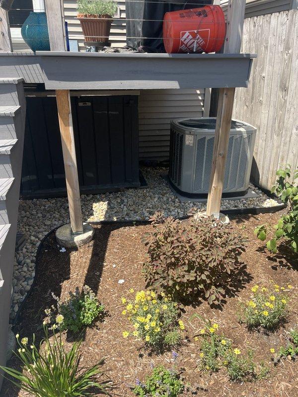 Conducted site assessment for new mini-split installation at residential property. Evaluated existing electrical panel with 1200A main service and available circuit capacity, photographed outdoor HVAC equipment location beneath raised deck with adequate clearance and gravel base, and documented installation requirements for Quilt partner coordination.