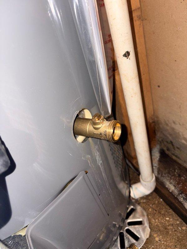Responded to service call for leaking water heater supply valve. Upon inspection, identified brass stop valve at water heater inlet showing active leak at base connection point. Shut down water supply to isolate unit and prevent further water damage. Removed defective valve assembly and obtained replacement parts from office. Installed new brass stop valve with proper thread sealant and torque specifications. Restored water supply, pressurized system, and performed leak check to verify repair integrity. Confirmed no additional moisture or dripping at connection points. Water heater operational and functioning properly upon completion.