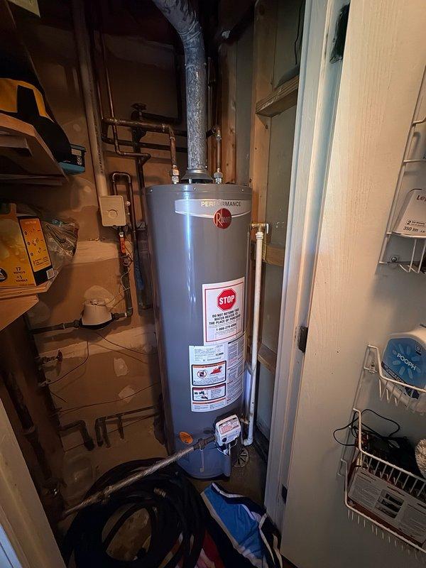 Responded to service call for leaking water heater supply valve. Upon inspection, identified brass stop valve at water heater inlet showing active leak at base connection point. Shut down water supply to isolate unit and prevent further water damage. Removed defective valve assembly and obtained replacement parts from office. Installed new brass stop valve with proper thread sealant and torque specifications. Restored water supply, pressurized system, and performed leak check to verify repair integrity. Confirmed no additional moisture or dripping at connection points. Water heater operational and functioning properly upon completion.