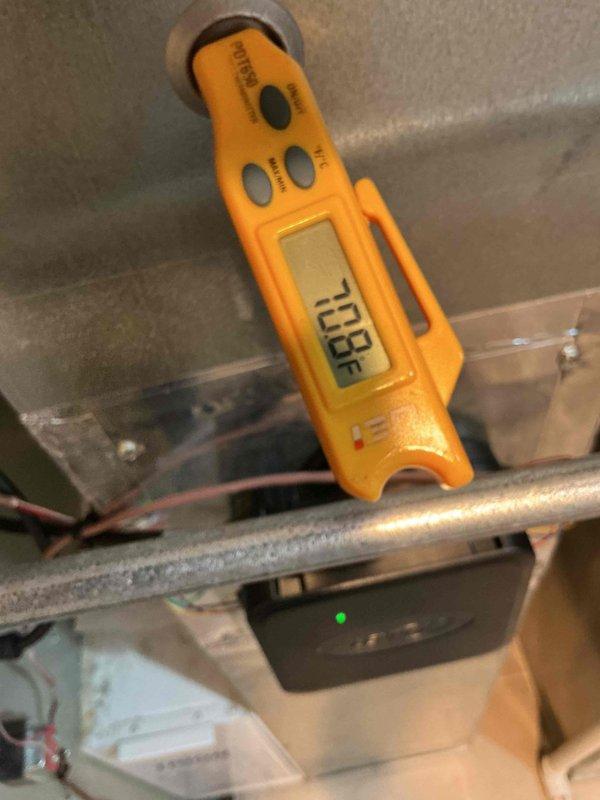 Responded to warranty callback for second floor cooling issue. Performed diagnostic temperature measurements at air handler unit, recording supply air temperature of 46.3°F and return air temperature of 73.9°F, confirming system is producing adequate temperature differential and operating within normal parameters.