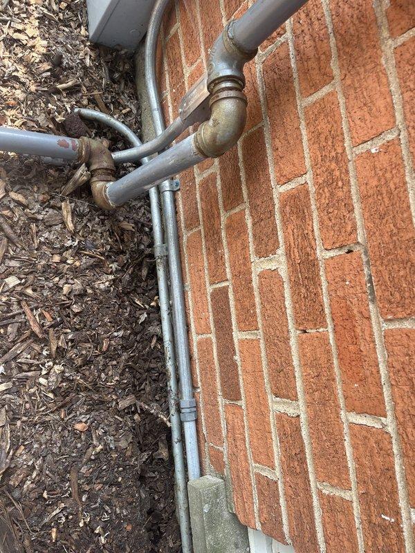 Responded to no cooling complaint and found system had been off due to previous frozen coil condition. Upon arrival, performed diagnostic testing of refrigerant charge and temperature differentials, which revealed all readings within normal parameters. Identified severely restricted air filter as root cause of frozen evaporator coil and loss of cooling capacity. Replaced air filter and performed complete system maintenance including inspection of both indoor and outdoor equipment. During maintenance inspection, discovered failed blower capacitor reading out of specification, condenser capacitor testing out of range, and contactor showing pitting on contact points. Replaced all three failed components to restore proper system operation. Discussed system age and replacement options with homeowner, who elected to proceed with component repairs at this time. Verified proper system operation with all equipment running within manufacturer specifications and delivering adequate cooling upon c