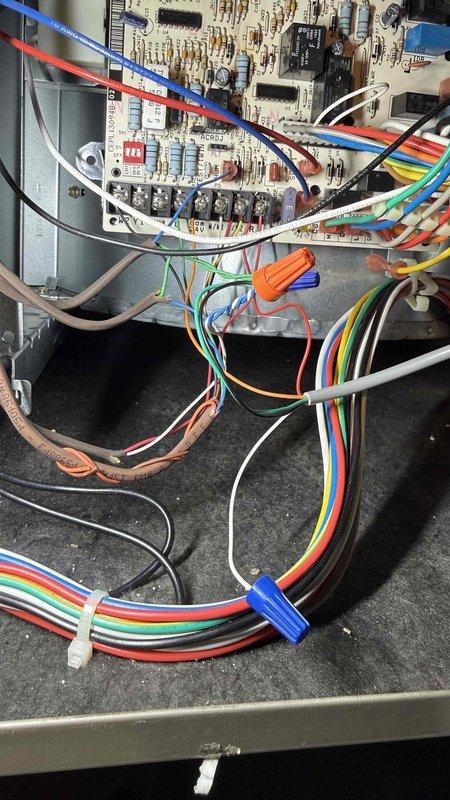 Responded to callback for recurring cooling issue following previous service visit. Upon arrival, verified thermostat displaying 73°F with customer reporting inadequate cooling and indoor temperature of 76°F. Inspected HVAC control board and wiring connections within air handler, checking all low-voltage control wiring, power connections, and relay operations for proper function. Documented system conditions with photos of thermostat operation and control board assembly to verify system status and troubleshoot recurring temperature control concerns.