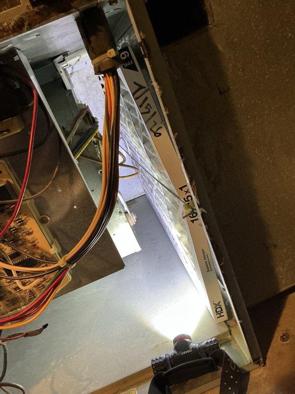 Responded to no cooling complaint with system running continuously and thermostat not reaching setpoint. Performed diagnostic evaluation of Carrier HVAC system including basement-mounted furnace with air handler and associated ductwork. Inspected refrigerant lines, electrical connections, and control wiring at both indoor units. Documented equipment information and captured photographic records of system installation and components for service file. Discussed available repair options and maintenance program benefits with customer.