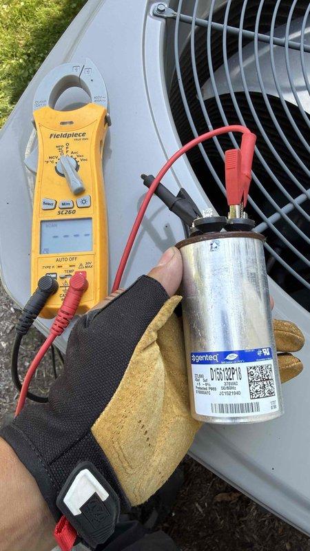 Responded to no-cool complaint on residential air conditioning system. Upon inspection, diagnosed failed dual-run capacitor preventing outdoor fan motor operation while compressor attempted to run. Tested capacitor with digital multimeter, confirming capacitance values were out of specification. Replaced defective capacitor with properly rated unit, restored system to normal cooling operation, and verified proper amp draw on both fan motor and compressor. Discussed preventative maintenance options for second AC unit on property and reviewed available service plan benefits.