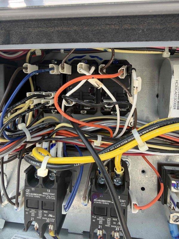 Responded to commercial cooling complaint at preschool facility unable to maintain temperature below 76°F. Performed diagnostic inspection of rooftop unit, examining Copeland compressor assembly, electrical control panel, contactors, and associated wiring connections. Documented system components including capacitor housing, terminal blocks, and control circuitry for assessment. Coordinated with office for approval authorization prior to proceeding with repairs per established protocol for commercial property management accounts.