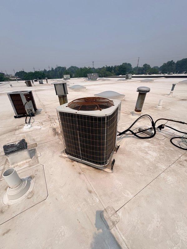 Responded to no cooling complaint at commercial tenant space. Upon inspection of rooftop HVAC unit, found failed dual run capacitor preventing compressor and condenser fan operation. Replaced defective capacitor, verified proper electrical connections, and confirmed system returned to normal cooling operation with all components functioning correctly.