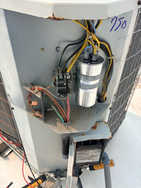 Responded to no cooling complaint at commercial tenant space. Upon inspection of rooftop HVAC unit, found failed dual run capacitor preventing compressor and condenser fan operation. Replaced defective capacitor, verified proper electrical connections, and confirmed system returned to normal cooling operation with all components functioning correctly.