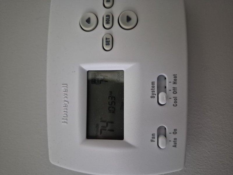 Completed comprehensive AC tune-up service on a 2-system residential HVAC installation per promotional maintenance agreement. Performed standard preventive maintenance procedures including system diagnostics with digital multimeter, verified electrical readings and system performance parameters, and documented equipment condition with photographs of outdoor condenser unit and indoor Honeywell thermostat control. Both systems operational and functioning within normal specifications upon completion.