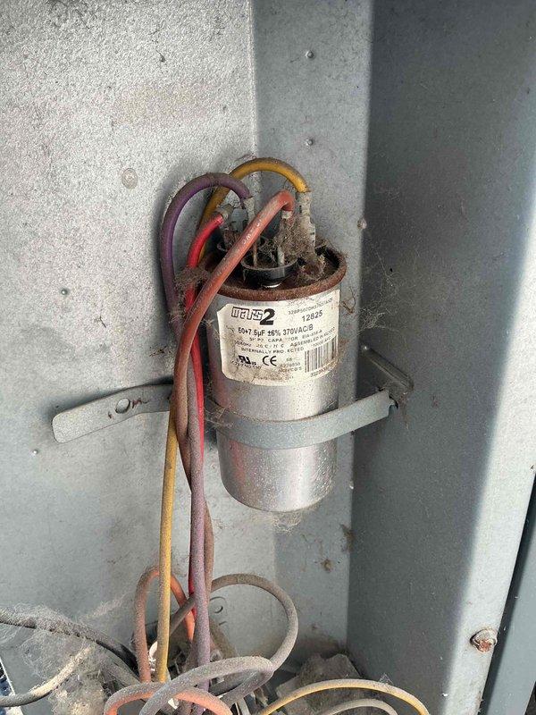 Responded to no cooling call at residential property. Upon arrival, performed diagnostic inspection of air conditioning system. Inspected condensing unit components including capacitor and electrical connections. Found capacitor with proper MARS2 replacement specifications installed and wiring connections secure. Verified refrigerant line sets and service tags properly labeled. Documented equipment condition with photos showing capacitor assembly, electrical terminations, and refrigerant piping infrastructure. System operational at time of inspection.