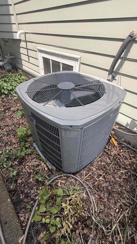 Responded to no cooling call on 8-year-old residential air conditioning system. Upon arrival, performed initial diagnostic assessment of outdoor condenser unit and indoor thermostat operation. Verified thermostat settings on White-Rodgers programmable unit, confirming proper cooling mode selection and temperature setpoint. Inspected outdoor condenser unit positioned on concrete pad, noting general condition of equipment and surrounding area. Checked electrical connections, circuit breakers, and power supply to system. Evaluated air filter condition and airflow. Documented equipment information and captured photos of condenser unit and thermostat for service records. Discussed system performance concerns and provided diagnostic findings to homeowner.