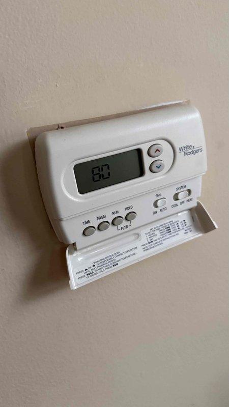 Responded to no cooling call on 8-year-old residential air conditioning system. Upon arrival, performed initial diagnostic assessment of outdoor condenser unit and indoor thermostat operation. Verified thermostat settings on White-Rodgers programmable unit, confirming proper cooling mode selection and temperature setpoint. Inspected outdoor condenser unit positioned on concrete pad, noting general condition of equipment and surrounding area. Checked electrical connections, circuit breakers, and power supply to system. Evaluated air filter condition and airflow. Documented equipment information and captured photos of condenser unit and thermostat for service records. Discussed system performance concerns and provided diagnostic findings to homeowner.
