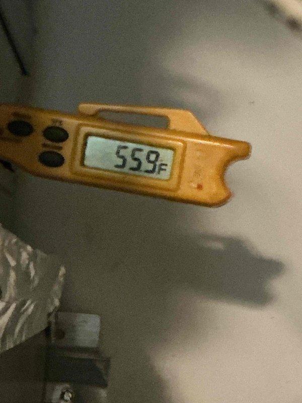 Responded to return visit for HVAC system not cooling with thermostat reading 77°F unchanged from previous day's service call. Upon inspection of the indoor air handler unit, performed diagnostic testing including temperature measurements of system components, verified thermostat settings were properly configured for cooling mode, confirmed filter condition and electrical breakers were operational, and documented equipment information and current operating conditions with photos for service records.