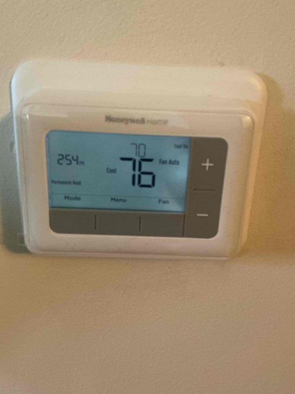 Responded to no-cool call on 4-year-old central air conditioning system. Upon arrival, confirmed unit would not power on and thermostat displayed permanent hold setting at 70°F with ambient temperature reading of 76°F. Inspected outdoor condensing unit and indoor evaporator coil assembly. Found evaporator coil showing normal operational wear with some minor debris accumulation between fins and typical copper refrigerant line oxidation consistent with unit age. Verified thermostat functionality and system wiring connections. Troubleshot electrical components and restored system operation, confirming proper startup sequence and cooling cycle initiation.