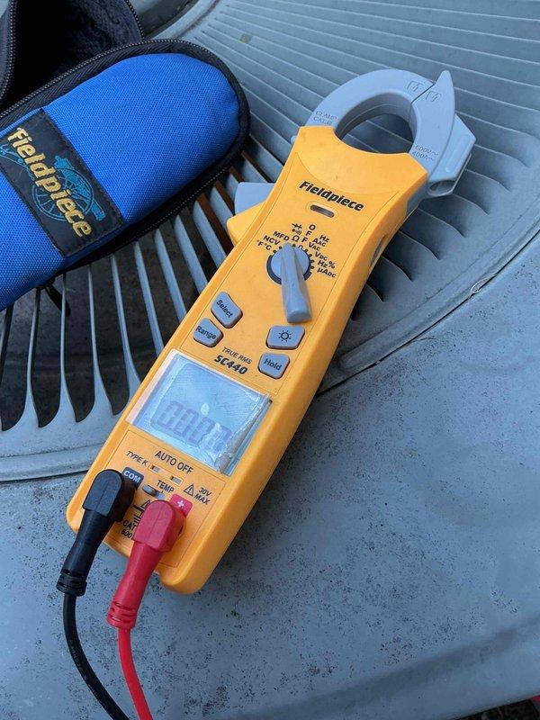 Responded to no cooling complaint on residential air conditioning system. Upon arrival, performed diagnostic testing using clamp meter at outdoor condenser unit to verify electrical readings and system operation. Measured supply air temperature at floor register, which indicated 53.4°F discharge temperature. Condenser unit fins were found in clean condition with normal airflow. System evaluated and necessary corrective action completed to restore proper cooling operation.