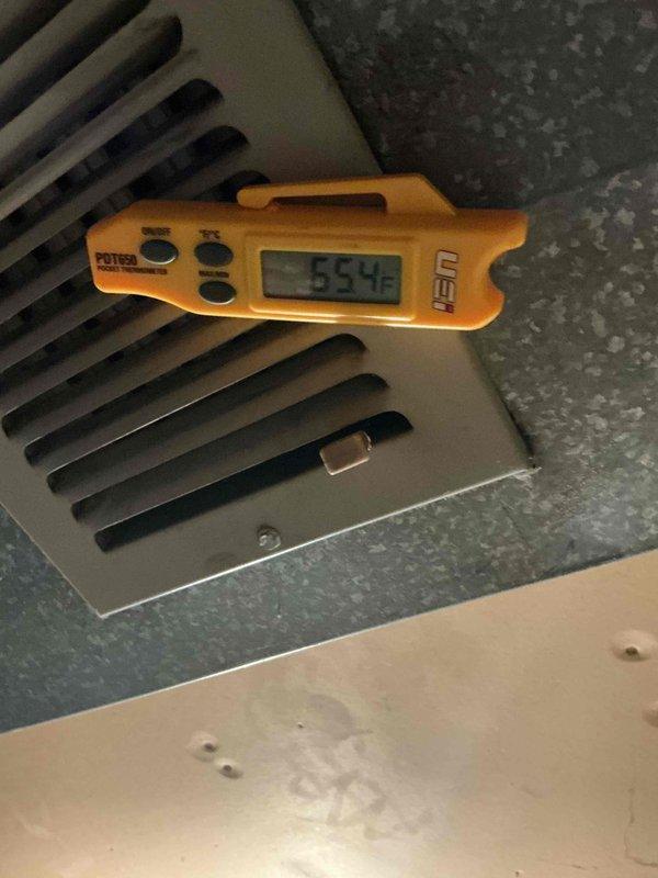 Responded to no cooling complaint on residential air conditioning system. Upon arrival, performed diagnostic testing using clamp meter at outdoor condenser unit to verify electrical readings and system operation. Measured supply air temperature at floor register, which indicated 53.4°F discharge temperature. Condenser unit fins were found in clean condition with normal airflow. System evaluated and necessary corrective action completed to restore proper cooling operation.