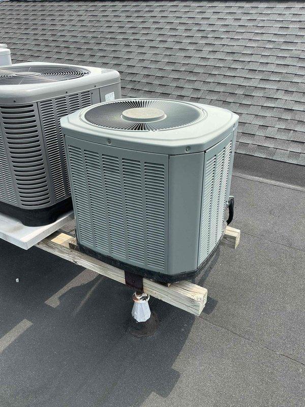 Responded to service call for non-operational air conditioning unit two on dual-system installation. Upon arrival, inspected 18-20 year old rooftop condenser units and verified customer complaint. Evaluated aging system condition, checked electrical connections, and assessed refrigerant lines. Documented equipment location and current operating status with photographic evidence. Updated customer contact information in service records for future maintenance coordination.