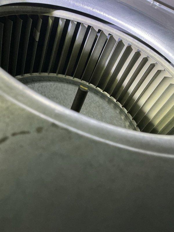Responded to no-cooling call on 6-9 year old HVAC system with suspected capacitor issue. Upon arrival, performed diagnostic assessment of cooling equipment including temperature measurements at supply ductwork, which indicated inadequate airflow and temperature differential. Inspection of blower assembly revealed significant dust and debris accumulation on squirrel cage fan wheel and interior housing components, restricting airflow and reducing system efficiency. Documented equipment condition with thermal readings showing supply air temperature of 96.8°F, confirming insufficient cooling performance. Presented findings to customer regarding blower contamination and its impact on system operation, along with repair options to restore proper cooling function.